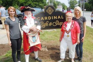 Cardinal Cafe and Shop owners Nicole Tarasick (left) and Sylvie Smith, right are joined by Town Crier Paddy O'Connor and Mayor Frances Smith at their grand opening on July 4