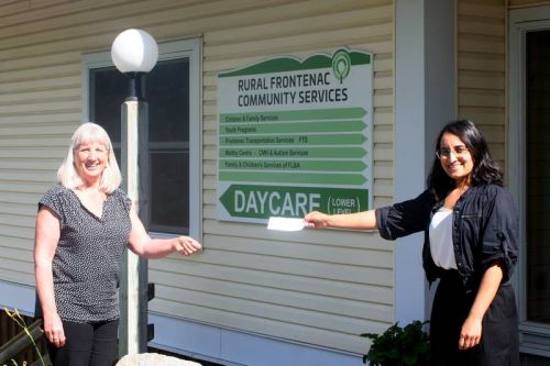 Amrit Kaillon (r) presenting a cheque for over $3,000 to Louise Moody (l) from Rural Frontenac Community Services (RFCS). The money came from surplus revenue from holiday dinners prepared by the Caremongering Sharbot Lake and Area group and from cash donations. The Frontenac Transportation Program, which is run by RFCS, continues to provide delivery services for shut-ins