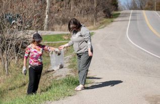 Sharon Maitland, left, and Jana Johnson, picking up garbage on the side of Perth Road at Norman Lane.