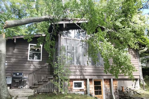 In an instant, a powerful storm overturned boats and docks, and uprooted trees sending limbs crashing down on power lines, and a number of vehicles and houses in the vicinities of Arden, Sharbot Lake and Bolingbroke on Friday afternoon (September 21)